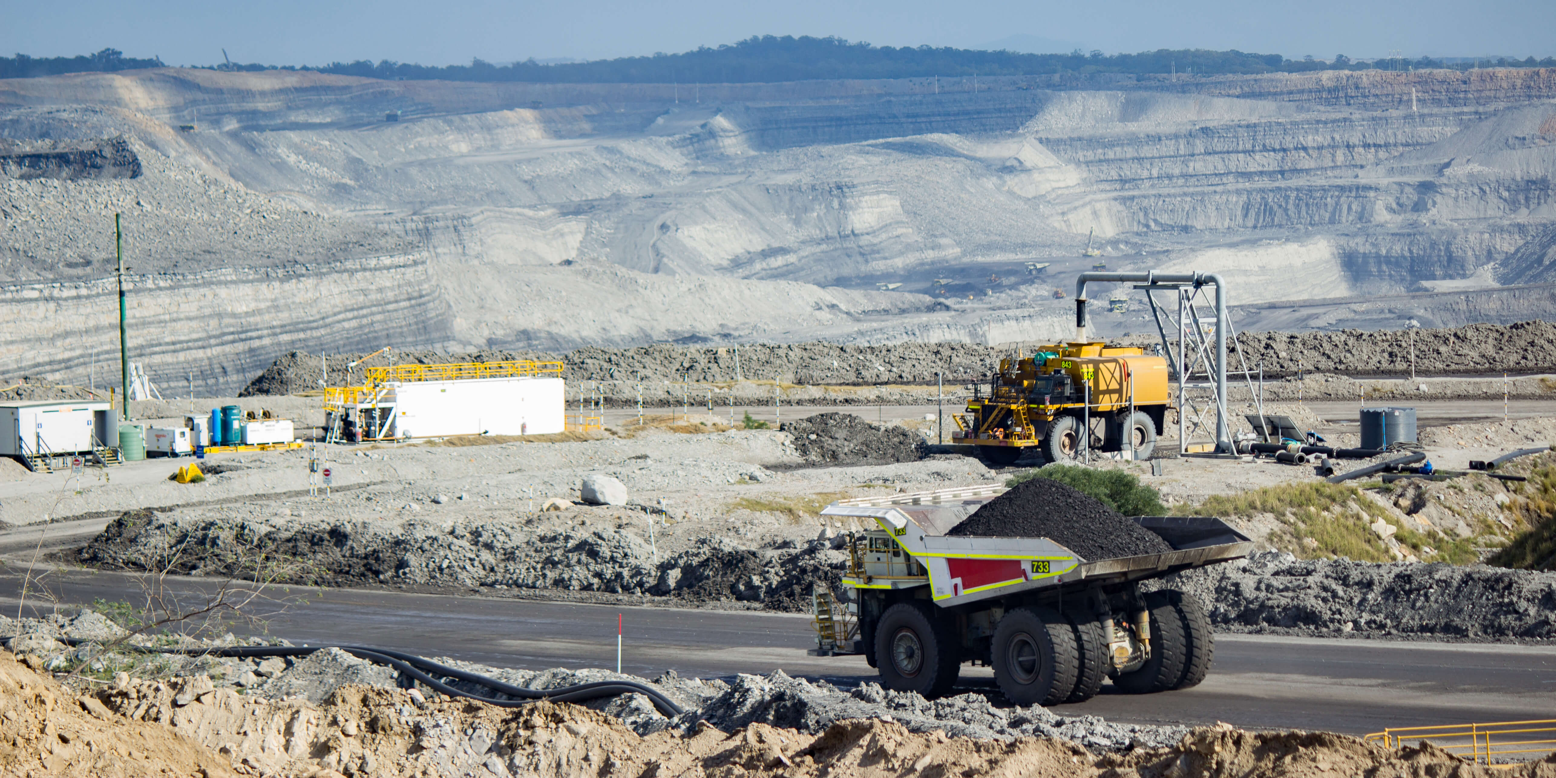 Dump truck carting coal through open cut mine