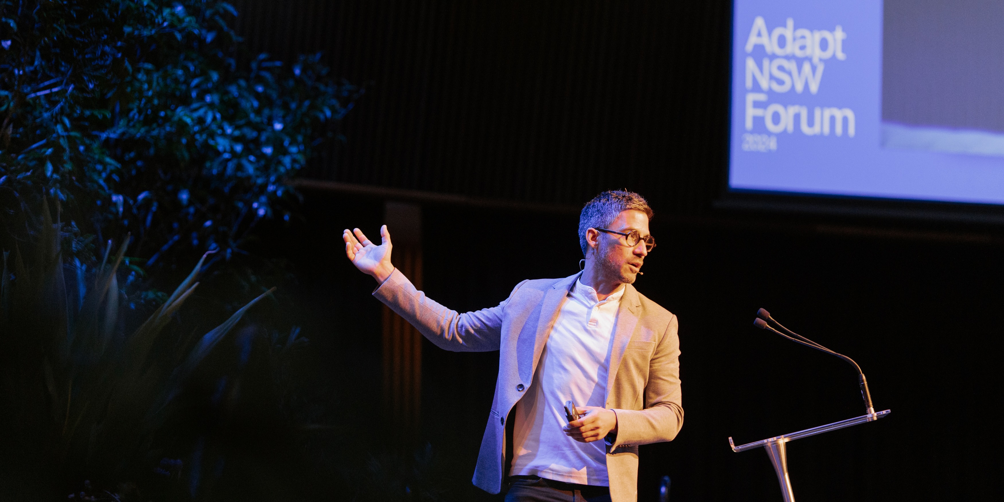 Male presenter standing on stage